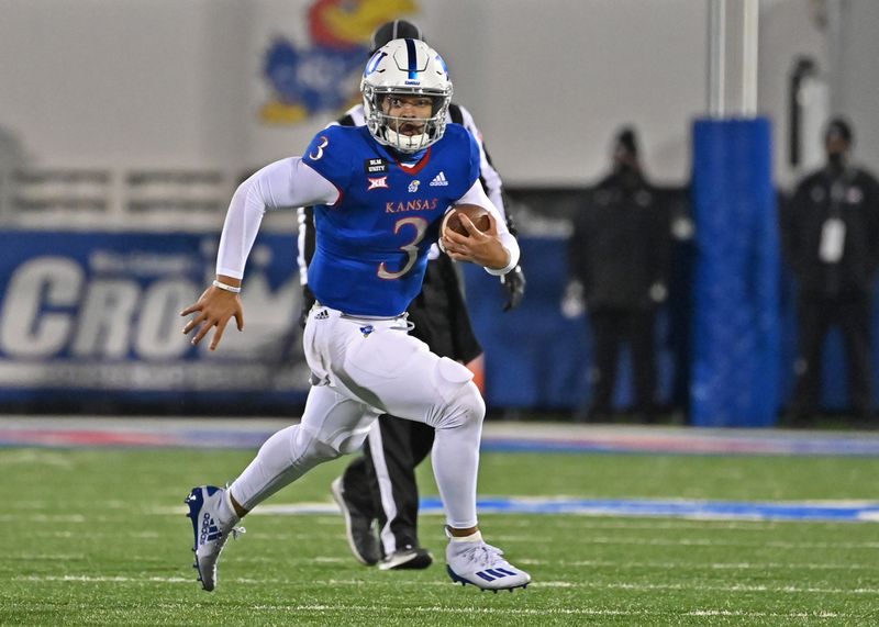 Nov 28, 2020; Lawrence, Kansas, USA; Kansas Jayhawks quarterback Miles Kendrick (3) runs up field during the fourth quarter against the Kansas Jayhawks at David Booth Kansas Memorial Stadium. Mandatory Credit: Peter Aiken-USA TODAY Sports