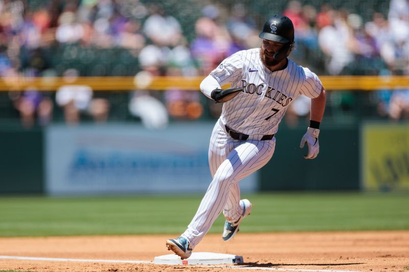 Jun 5, 2024; Denver, Colorado, USA; Colorado Rockies second base Brendan Rodgers (7) runs home to score during the first inning against the Cincinnati Reds at Coors Field. Mandatory Credit: Andrew Wevers-USA TODAY Sports