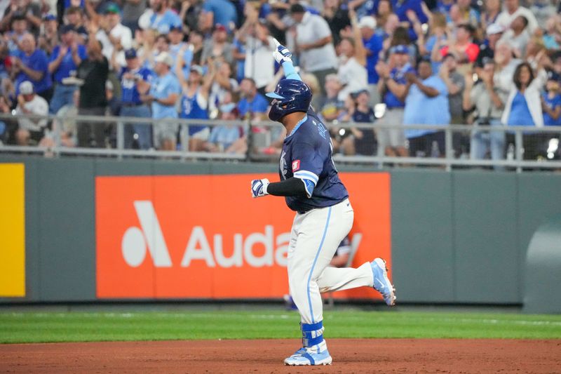 Aug 23, 2024; Kansas City, Missouri, USA; Kansas City Royals catcher Salvador Perez (13) runs the bases against the Philadelphia Phillies after hitting a two run home run in the third inning at Kauffman Stadium. Mandatory Credit: Denny Medley-USA TODAY Sports