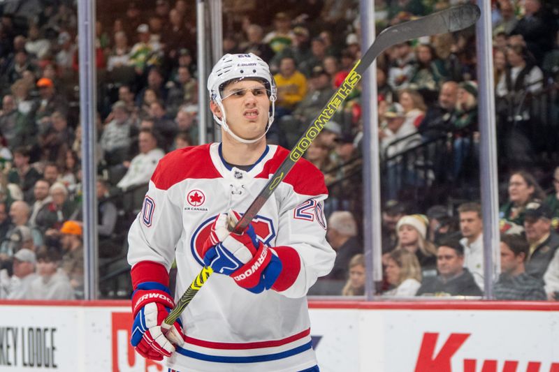 Nov 14, 2024; Saint Paul, Minnesota, USA; Montreal Canadiens left wing Juraj Slafkovsky (20) examines his stick after a play he did not like agains the Minnesota Wild in the third period at Xcel Energy Center. Mandatory Credit: Matt Blewett-Imagn Images