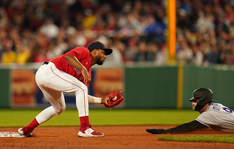 Jun 14, 2023; Boston, Massachusetts, USA; Colorado Rockies center fielder Brenton Doyle (9) tagged out at second base by Boston Red Sox second baseman Pablo Reyes (19) in the third inning at Fenway Park. Mandatory Credit: David Butler II-USA TODAY Sports