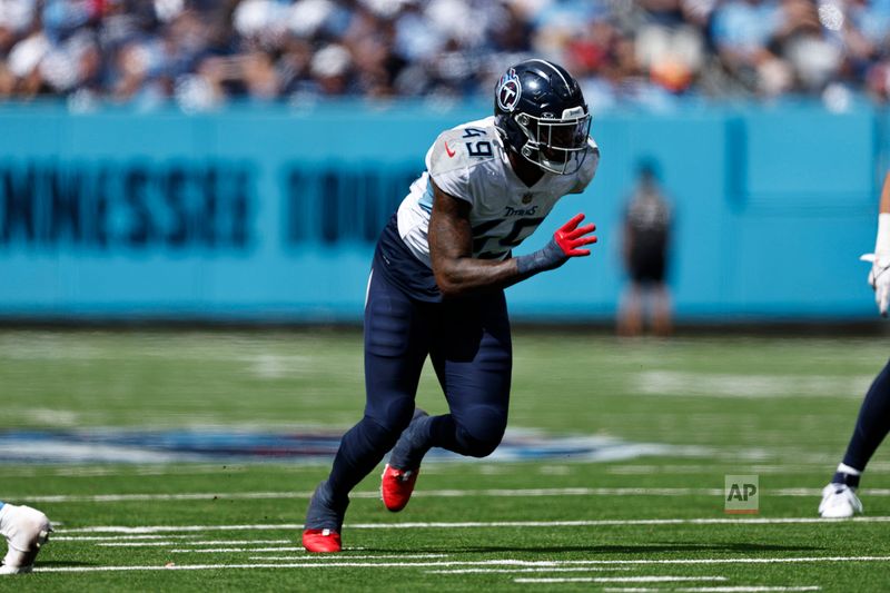 Tennessee Titans linebacker Arden Key (49) rushes during their NFL football against the Los Angeles Chargers game Sunday, Sept. 17, 2023, in Nashville, Tenn. (AP Photo/Wade Payne)