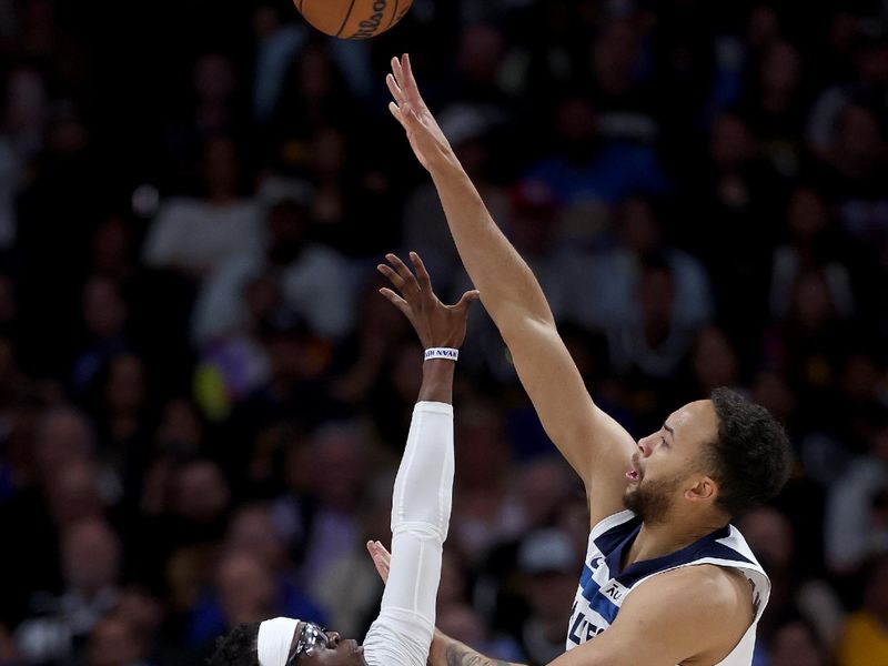 DENVER, COLORADO - APRIL 10: Kyle Anderson #1 of the Minnesota Timberwolves puts up a shot over Reggie Jackson #7 of the Denver Nuggets during the first quarter at Ball Arena on April 10, 2024 in Denver, Colorado. NOTE TO USER: User expressly acknowledges and agrees that, by downloading and or using this photograph, User is consenting to the terms and conditions of the Getty Images License Agreement.  (Photo by Matthew Stockman/Getty Images)