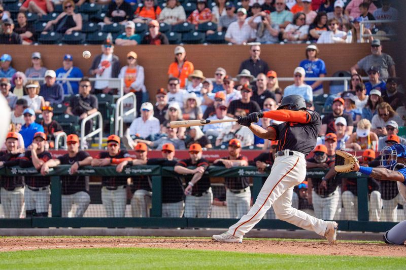 Feb 24, 2024; Scottsdale, Arizona, USA; San Francisco Giants infielder Otto Lopez (54) hits a home run against the Chicago Cubs in the ninth inning during spring training game at Scottsdale Stadium. Mandatory Credit: Allan Henry-USA TODAY Sports