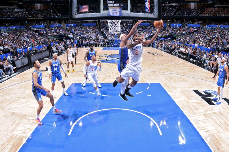 ORLANDO, FL - MARCH 29: Kawhi Leonard #2 of the LA Clippers drives to the basket during the game against the Orlando Magic on March 29, 2024 at the Kia Center in Orlando, Florida. NOTE TO USER: User expressly acknowledges and agrees that, by downloading and or using this photograph, User is consenting to the terms and conditions of the Getty Images License Agreement. Mandatory Copyright Notice: Copyright 2024 NBAE (Photo by Fernando Medina/NBAE via Getty Images)