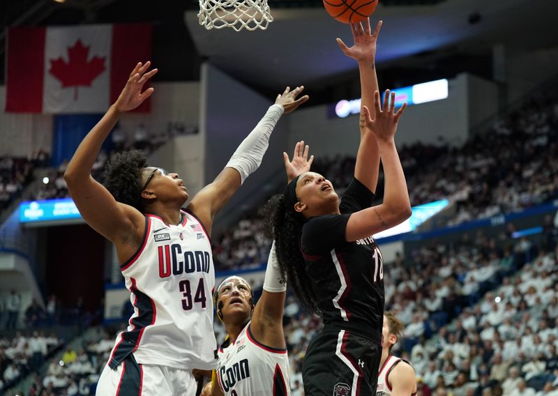 Feb 5, 2023; Hartford, Connecticut, USA; South Carolina Gamecocks center Kamilla Cardoso (10) shoots against UConn Huskies forward Ayanna Patterson (34) in the second half at XL Center. Mandatory Credit: David Butler II-USA TODAY Sports