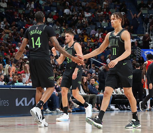 NEW ORLEANS, LA - NOVEMBER 4: Brandon Ingram #14 and Dyson Daniels #11 of the New Orleans Pelicans high five during the game against the Atlanta Hawks on November 4, 2023 at the Smoothie King Center in New Orleans, Louisiana. NOTE TO USER: User expressly acknowledges and agrees that, by downloading and or using this Photograph, user is consenting to the terms and conditions of the Getty Images License Agreement. Mandatory Copyright Notice: Copyright 2023 NBAE (Photo by Layne Murdoch Jr./NBAE via Getty Images)