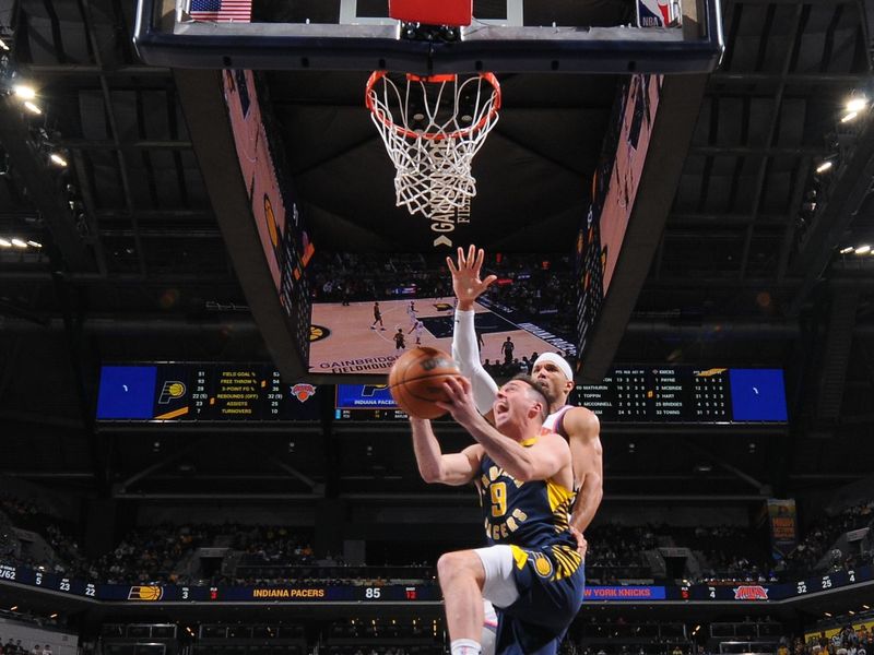 INDIANAPOLIS, IN - FEBRUARY 11:  T.J. McConnell #9 of the Indiana Pacers drives to the basket during the game against the New York Knicks on February 11, 2025 at Gainbridge Fieldhouse in Indianapolis, Indiana. NOTE TO USER: User expressly acknowledges and agrees that, by downloading and or using this Photograph, user is consenting to the terms and conditions of the Getty Images License Agreement. Mandatory Copyright Notice: Copyright 2025 NBAE (Photo by Ron Hoskins/NBAE via Getty Images)