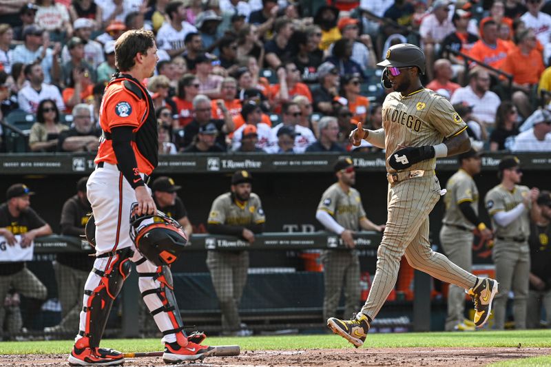 Jul 27, 2024; Baltimore, Maryland, USA; San Diego Padres outfielder Jurickson Profar (10) scores in the second inning against the Baltimore Orioles  at Oriole Park at Camden Yards. Mandatory Credit: Tommy Gilligan-USA TODAY Sports