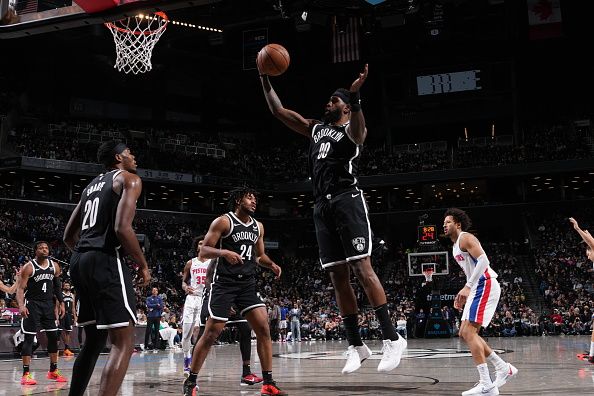 BROOKLYN, NY - DECEMBER 23: Royce O'Neale #00 of the Brooklyn Nets grabs a rebound during the game against the Detroit Pistons on December 23, 2023 at Barclays Center in Brooklyn, New York. NOTE TO USER: User expressly acknowledges and agrees that, by downloading and or using this Photograph, user is consenting to the terms and conditions of the Getty Images License Agreement. Mandatory Copyright Notice: Copyright 2023 NBAE (Photo by Jesse D. Garrabrant/NBAE via Getty Images)