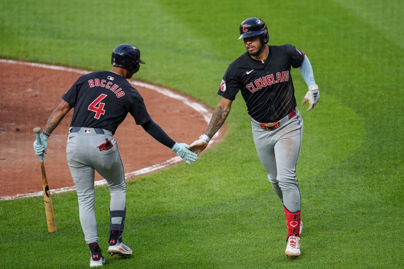 Jun 26, 2024; Baltimore, Maryland, USA; Cleveland Guardians third base Gabriel Arias (13) celebrates with shortstop Brayan Rocchio (4) after hitting a home run during the third inning against the Baltimore Orioles at Oriole Park at Camden Yards. Mandatory Credit: Reggie Hildred-USA TODAY Sports