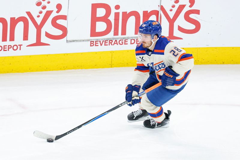 Jan 12, 2026; Chicago, Illinois, USA; Edmonton Oilers center Jack Roslovic (28) controls the puck against the Chicago Blackhawks during the second period at United Center. Mandatory Credit: Kamil Krzaczynski-Imagn Images