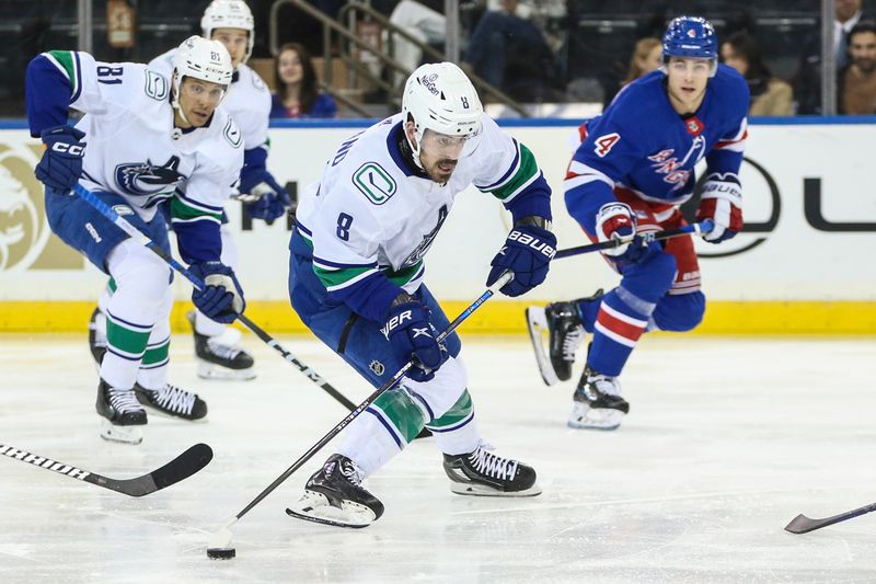 Jan 8, 2024; New York, New York, USA;  Vancouver Canucks right wing Conor Garland (8) controls the puck in the second period against the New York Rangers at Madison Square Garden. Mandatory Credit: Wendell Cruz-USA TODAY Sports