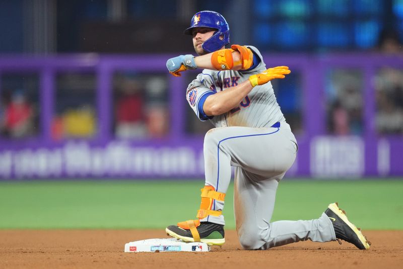 Jul 20, 2024; Miami, Florida, USA;  New York Mets first baseman Pete Alonso (20) kneels on second base after hitting a double against the Miami Marlins in the fourth inning at loanDepot Park. Mandatory Credit: Jim Rassol-USA TODAY Sports