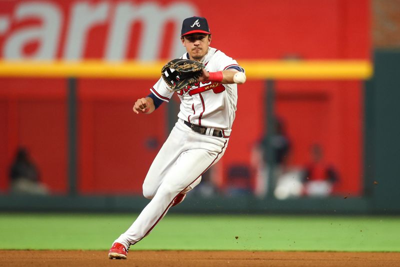 Aug 16, 2023; Atlanta, Georgia, USA; Atlanta Braves second baseman Nicky Lopez (15) fields a ground ball against the New York Yankees in the seventh inning at Truist Park. Mandatory Credit: Brett Davis-USA TODAY Sports