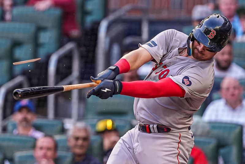 May 7, 2024; Cumberland, Georgia,USA; Boston Red Sox catcher Reese McGuire (3) breaks his bat while hitting a single against the Atlanta Braves during the second inning at Truist Park. Mandatory Credit: Dale Zanine-USA TODAY Sports