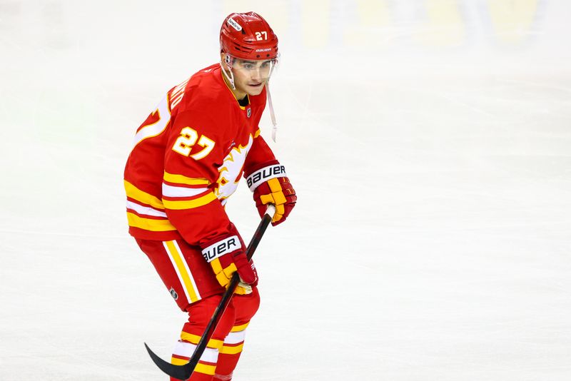 Oct 15, 2024; Calgary, Alberta, CAN; Calgary Flames right wing Matt Coronato (27) skates during the warmup period against the Chicago Blackhawks at Scotiabank Saddledome. Mandatory Credit: Sergei Belski-Imagn Images