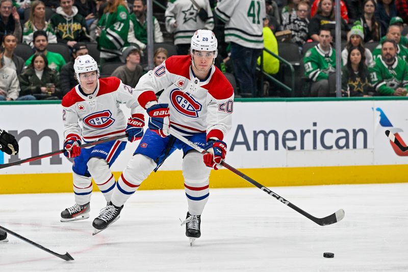 Jan 2, 2024; Dallas, Texas, USA; Montreal Canadiens left wing Juraj Slafkovsky (20) passes the puck to center Nick Suzuki (not pictured)who scores a goal against the Dallas Stars during the first period at the American Airlines Center. Mandatory Credit: Jerome Miron-USA TODAY Sports