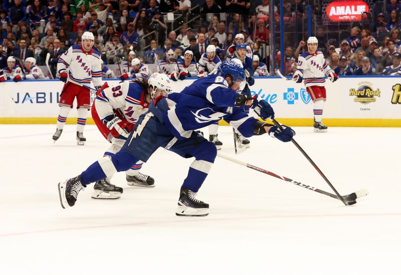 Mar 14, 2024; Tampa, Florida, USA; Tampa Bay Lightning right wing Nikita Kucherov (86) scores a goal as New York Rangers center Mika Zibanejad (93) attempted to defend during the third period at Amalie Arena. Mandatory Credit: Kim Klement Neitzel-USA TODAY Sports