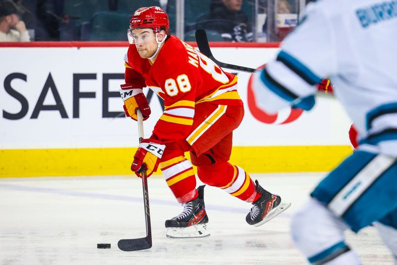 Apr 18, 2024; Calgary, Alberta, CAN; Calgary Flames left wing Andrew Mangiapane (88) skates with the puck against the San Jose Sharks during the second period at Scotiabank Saddledome. Mandatory Credit: Sergei Belski-USA TODAY Sports