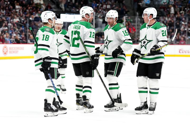 Feb 27, 2024; Denver, Colorado, USA; Dallas Stars center Sam Steel (18) and center Radek Faksa (12) and center Craig Smith (15) and left wing Jason Robertson (21) huddle in the third period against the Colorado Avalanche at Ball Arena. Mandatory Credit: Ron Chenoy-USA TODAY Sports