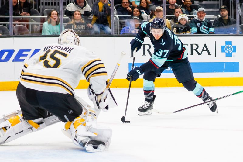 Feb 26, 2024; Seattle, Washington, USA; Seattle Kraken center Yanni Gourde (37) skates with the puck against the Boston Bruins during the first period at Climate Pledge Arena. Mandatory Credit: Joe Nicholson-USA TODAY Sports