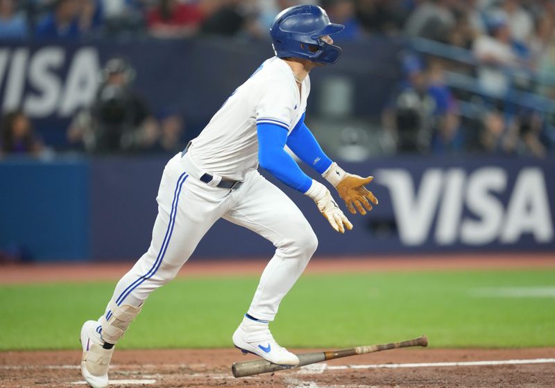 Jun 28, 2023; Toronto, Ontario, CAN; Toronto Blue Jays second baseman Cavan Biggio (8) hits a double against the San Francisco Giants during the seventh inning at Rogers Centre. Mandatory Credit: Nick Turchiaro-USA TODAY Sports