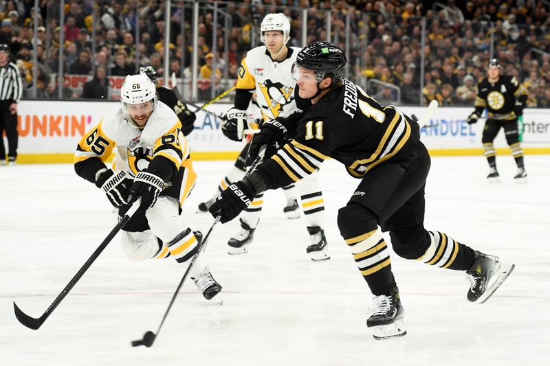 oJan 4, 2024; Boston, Massachusetts, USA; Boston Bruins center Trent Frederic (11) shoots the puck while Pittsburgh Penguins defenseman Erik Karlsson (65) defends during the third period at TD Garden. Mandatory Credit: Bob DeChiara-USA TODAY Sports