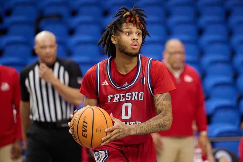 Feb 6, 2024; San Jose, California, USA; Fresno State Bulldogs guard Donavan Yap Jr. (0) dribbles the ball against the San Jose State Spartans during the second half at Provident Credit Union Event Center. Mandatory Credit: Robert Edwards-USA TODAY Sports