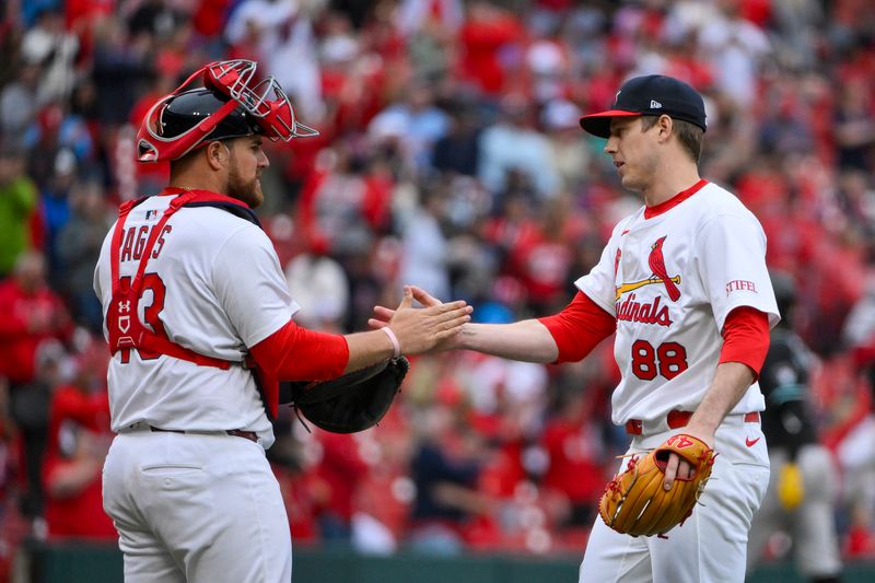 May 25, 2025; St. Louis, Missouri, USA;  St. Louis Cardinals relief pitcher Phil Maton (88) celebrates with catcher Pedro Pages (43) after the Cardinals defeated the Arizona Diamondbacks at Busch Stadium. Mandatory Credit: Jeff Curry-Imagn Images