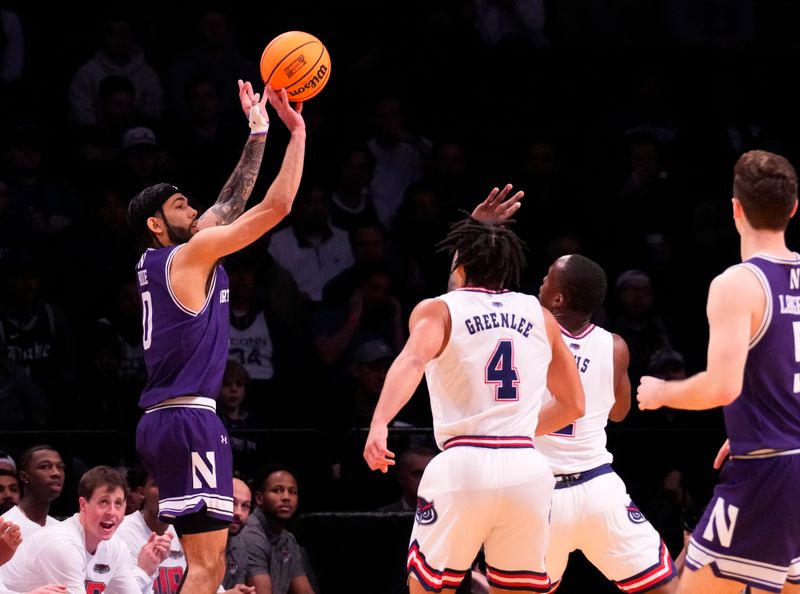 March 22, 2024, Brooklyn, NY, USA; Northwestern Wildcats guard Boo Buie (0) shoots against the Florida Atlantic Owls in the first round of the 2024 NCAA Tournament at the Barclays Center. Mandatory Credit: Robert Deutsch-USA TODAY Sports