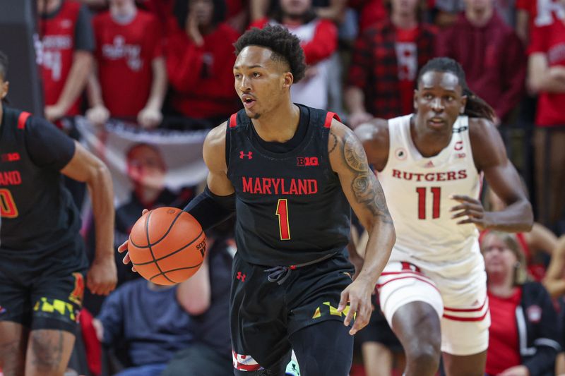 Jan 5, 2023; Piscataway, New Jersey, USA; Maryland Terrapins guard Jahmir Young (1) dribbles up court during the first half in front of Rutgers Scarlet Knights center Clifford Omoruyi (11) at Jersey Mike's Arena. Mandatory Credit: Vincent Carchietta-USA TODAY Sports