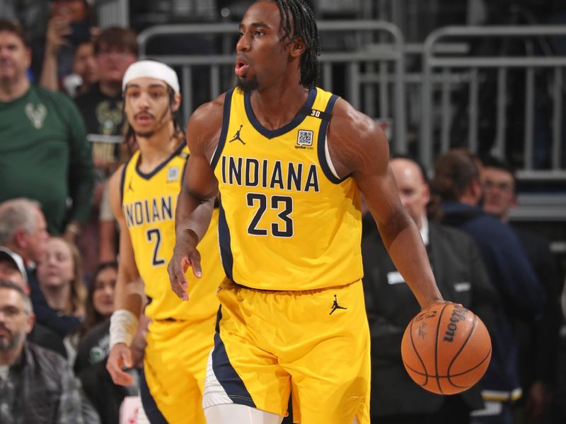 MILWAUKEE, WI - APRIL 21: Aaron Nesmith #23 of the Indiana Pacers dribbles the ball during the game against the Milwaukee Bucks during Round 1 Game 1 of the 2024 NBA Playoffs on April 21, 2024 at the Fiserv Forum Center in Milwaukee, Wisconsin. NOTE TO USER: User expressly acknowledges and agrees that, by downloading and or using this Photograph, user is consenting to the terms and conditions of the Getty Images License Agreement. Mandatory Copyright Notice: Copyright 2024 NBAE (Photo by Gary Dineen/NBAE via Getty Images).