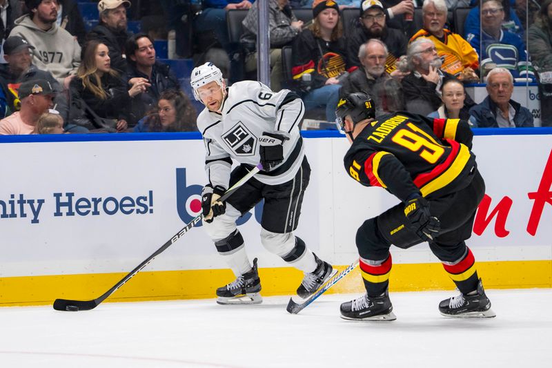 Mar 25, 2024; Vancouver, British Columbia, CAN; Los Angeles Kings forward Trevor Lewis (61) drives past Vancouver Canucks defenseman Nikita Zadorov (91) in the second period at Rogers Arena. Mandatory Credit: Bob Frid-USA TODAY Sports