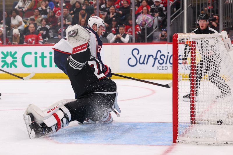 Feb 3, 2026; Newark, New Jersey, USA; Columbus Blue Jackets right wing Mathieu Olivier (24) scores a goal on New Jersey Devils goaltender Jacob Markstrom (25) during the third period at Prudential Center. Mandatory Credit: Ed Mulholland-Imagn Images