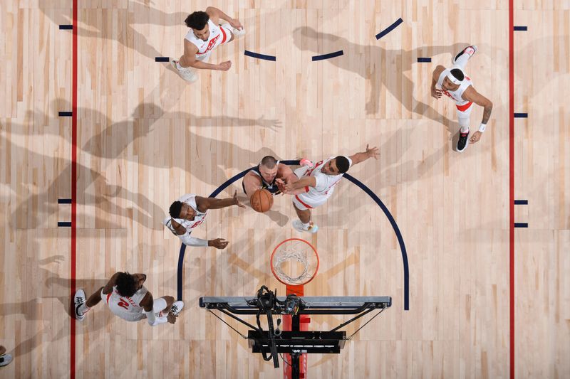 DENVER, CO - MARCH 11: Nikola Jokic #15 of the Denver Nuggets shoots the ball during the game against the Toronto Raptors on March 11, 2024 at the Ball Arena in Denver, Colorado. NOTE TO USER: User expressly acknowledges and agrees that, by downloading and/or using this Photograph, user is consenting to the terms and conditions of the Getty Images License Agreement. Mandatory Copyright Notice: Copyright 2024 NBAE (Photo by Bart Young/NBAE via Getty Images)