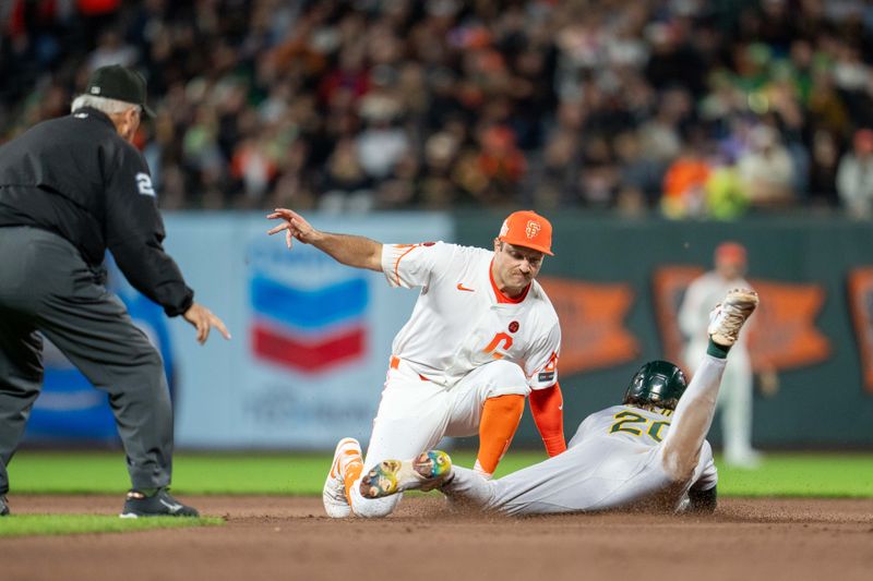 Jul 30, 2024; San Francisco, California, USA;  Oakland Athletics second baseman Zack Gelof (20) is tagged out stealing second base by San Francisco Giants second baseman Casey Schmitt (10) during the eighth inning at Oracle Park. Mandatory Credit: Neville E. Guard-USA TODAY Sports