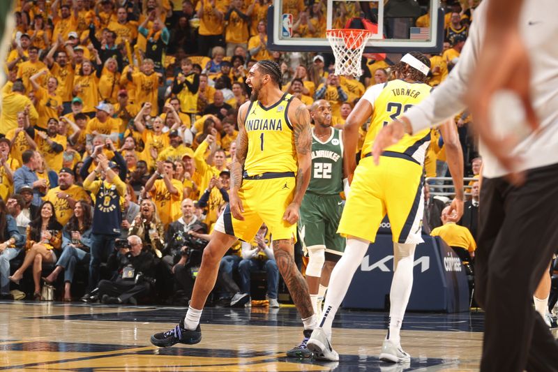 INDIANAPOLIS, IN - APRIL 26: Obi Toppin #1 of the Indiana Pacers /celebrates during the game against the Milwaukee Bucks during Round 1 Game 3 of the 2024 NBA Playoffs on April 26, 2024 at Gainbridge Fieldhouse in Indianapolis, Indiana. NOTE TO USER: User expressly acknowledges and agrees that, by downloading and or using this Photograph, user is consenting to the terms and conditions of the Getty Images License Agreement. Mandatory Copyright Notice: Copyright 2023 NBAE (Photo by Nathaniel S. Butler/NBAE via Getty Images)