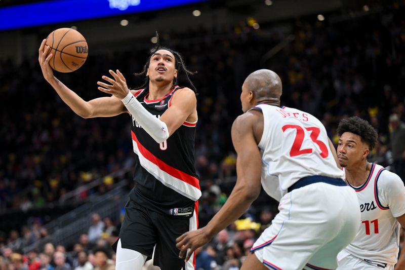 SEATTLE, WASHINGTON - OCTOBER 11: Dalano Banton #5 of the Portland Trail Blazers controls the ball against Kai Jones #23 of the LA Clippers during the fourth quarter of the Rain City Showcase game at Climate Pledge Arena on October 11, 2024 in Seattle, Washington. The LA Clippers won 101-99. NOTE TO USER: User expressly acknowledges and agrees that, by downloading and or using this photograph, User is consenting to the terms and conditions of the Getty Images License Agreement. (Photo by Alika Jenner/Getty Images)