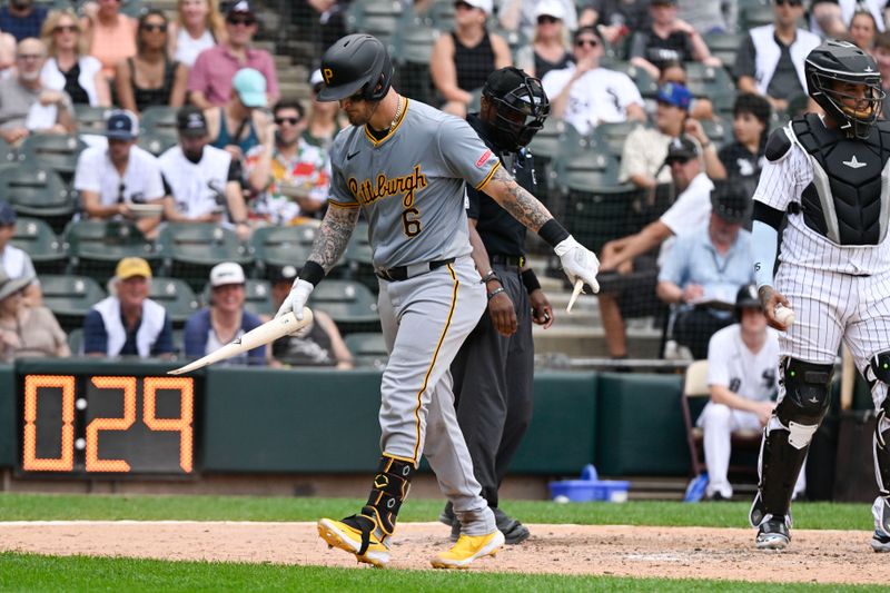 Jul 13, 2024; Chicago, Illinois, USA;  Pittsburgh Pirates catcher Yasmani Grandal (6) carries his broken bat after striking out on a foul bunt against the Chicago White Sox during the seventh inning at Guaranteed Rate Field. Mandatory Credit: Matt Marton-USA TODAY Sports