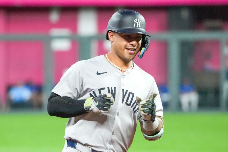 Jun 12, 2024; Kansas City, Missouri, USA; New York Yankees second baseman Gleyber Torres (25) celebrates while running the bases after hitting a three run home run against the Kansas City Royals in the seventh inning at Kauffman Stadium. Mandatory Credit: Denny Medley-USA TODAY Sports