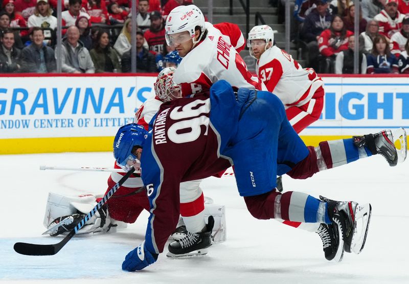 Mar 6, 2024; Denver, Colorado, USA; Detroit Red Wings defenseman Ben Chiarot (8) hits Colorado Avalanche right wing Mikko Rantanen (96) in the second period at Ball Arena. Mandatory Credit: Ron Chenoy-USA TODAY Sports