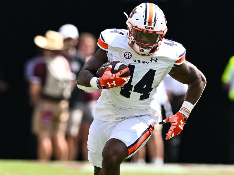 Sep 23, 2023; College Station, Texas, USA; Auburn Tigers running back Sean Jackson (44) runs the ball during the fourth quarter against the Texas A&M Aggies at Kyle Field. Mandatory Credit: Maria Lysaker-USA TODAY Sports