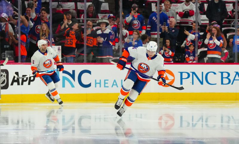 Apr 20, 2024; Raleigh, North Carolina, USA; New York Islanders center Bo Horvat (14) skates out onto the ice for the warmups before the game against the Carolina Hurricanes in game one of the first round of the 2024 Stanley Cup Playoffs at PNC Arena. Mandatory Credit: James Guillory-USA TODAY Sports