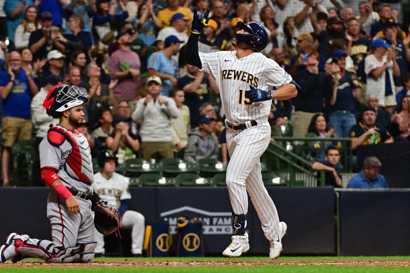 Sep 16, 2023; Milwaukee, Wisconsin, USA; Milwaukee Brewers right fielder Tyrone Taylor (15) reacts after hitting a solo home run in the fourth inning as Washington Nationals catcher Keibert Ruiz (20) looks on at American Family Field. Mandatory Credit: Benny Sieu-USA TODAY Sports