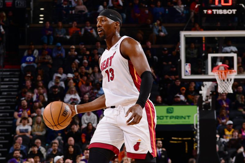 PHOENIX, AZ - NOVEMBER 6: Bam Adebayo #13 of the Miami Heat looks to pass the ball during the game against the Phoenix Suns on November 6, 2024 at Footprint Center in Phoenix, Arizona. NOTE TO USER: User expressly acknowledges and agrees that, by downloading and or using this photograph, user is consenting to the terms and conditions of the Getty Images License Agreement. Mandatory Copyright Notice: Copyright 2024 NBAE (Photo by Kate Frese/NBAE via Getty Images)