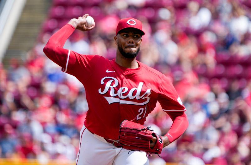 Jul 6, 2024; CINCINNATI, OHIO: Cincinnati Reds pitcher Hunter Greene (21) pitches to the Detroit Lions in the 1st inning at Great American Ball Park. Mandatory Credit: Cara Owsley-The Enquirer