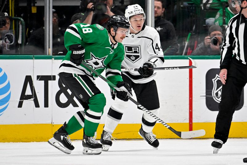 Jan 16, 2024; Dallas, Texas, USA; Dallas Stars center Sam Steel (18) and Los Angeles Kings defenseman Mikey Anderson (44) look for the puck in the Kings zone during the first period at the American Airlines Center. Mandatory Credit: Jerome Miron-USA TODAY Sports