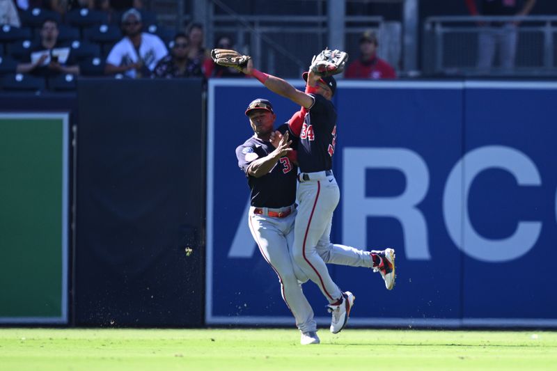 Jun 25, 2023; San Diego, California, USA; Washington Nationals center fielder Derek Hill (34) collides with left fielder Stone Garrett (36) after making a game-ending catch in the ninth inning against the San Diego Padres at Petco Park. Mandatory Credit: Orlando Ramirez-USA TODAY Sports