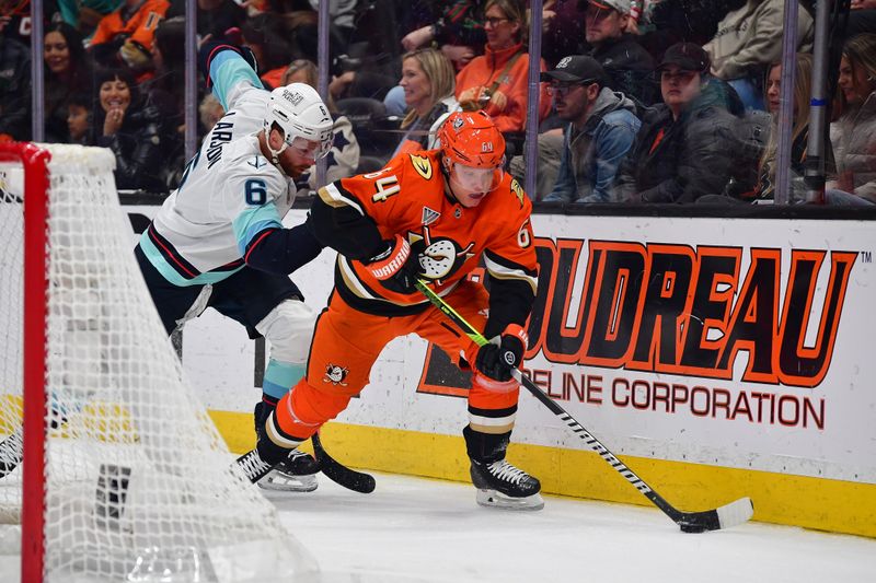 Feb 3, 2026; Anaheim, California, USA; Anaheim Ducks center Mikael Granlund (64) moves the puck against Seattle Kraken defenseman Adam Larsson (6) during the third period at Honda Center. Mandatory Credit: Gary A. Vasquez-Imagn Images